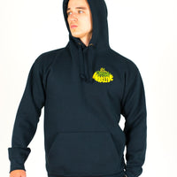 Person wearing a navy Junglist Massive hoodie with a yellow logo on a white background