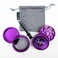 Purple metal herb grinder set with a gray drawstring bag, black cleaning brush, and mesh screen on a white background. The grinder lid shows the brand name 'Jnglst'.