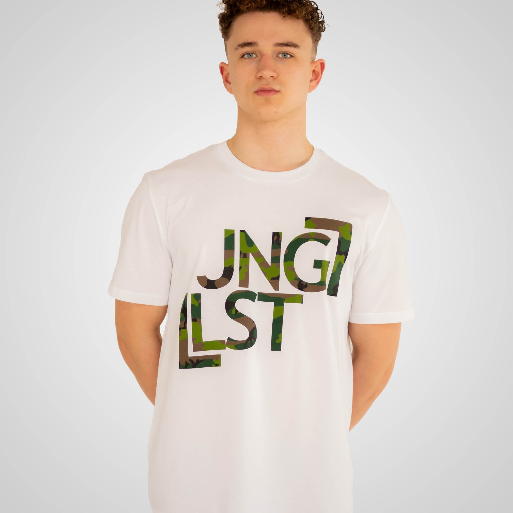Person wearing a white t-shirt with 'Jungle List' printed in green and black.