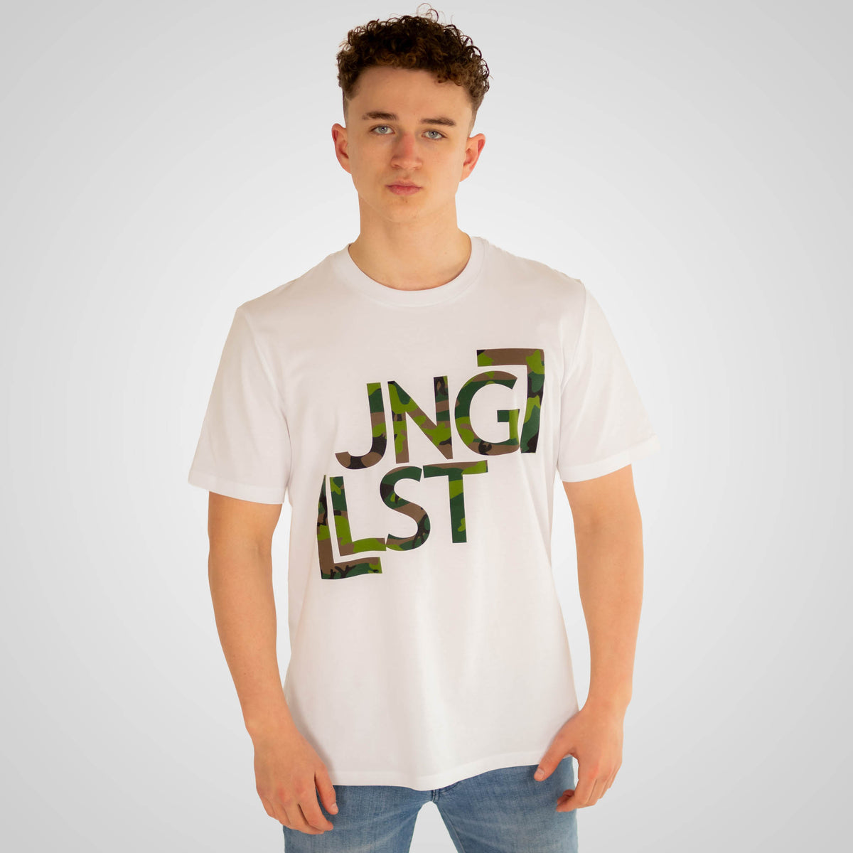 Person wearing a white t-shirt with 'Jungleist' text design on a plain background