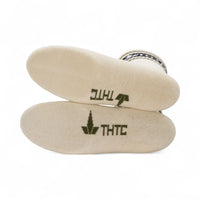 Beige socks with 'THTC' branding on a white background