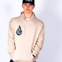 Person wearing a beige hoodie with a logo on a white background