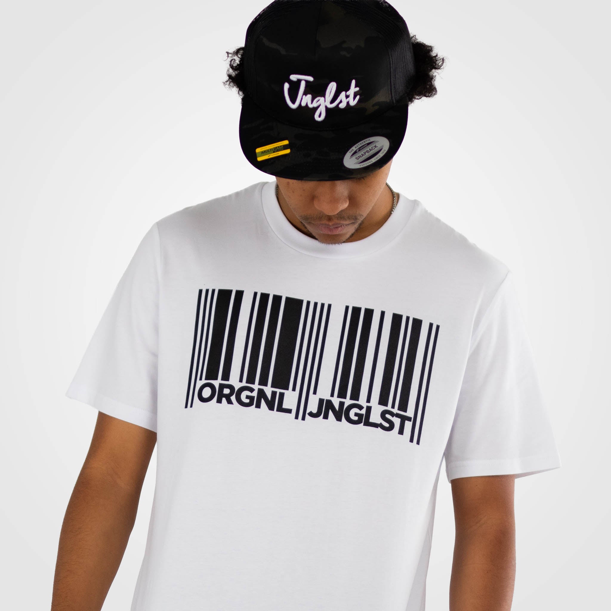 Junglist model wearing  white junglist t shirt with a barcode design