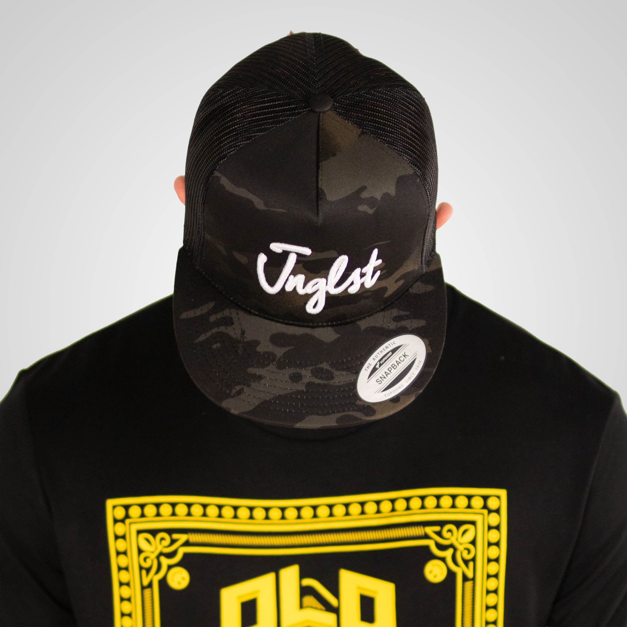 Black Camo Junglist Trucker Cap worn by model in t-shirt