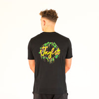 Model wearing a black Junglist t-shirt with colourful text and graphics on the back, standing against a white background.