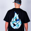 Person wearing a black t-shirt with a blue and white Born Outta Fire design on the back against a plain background