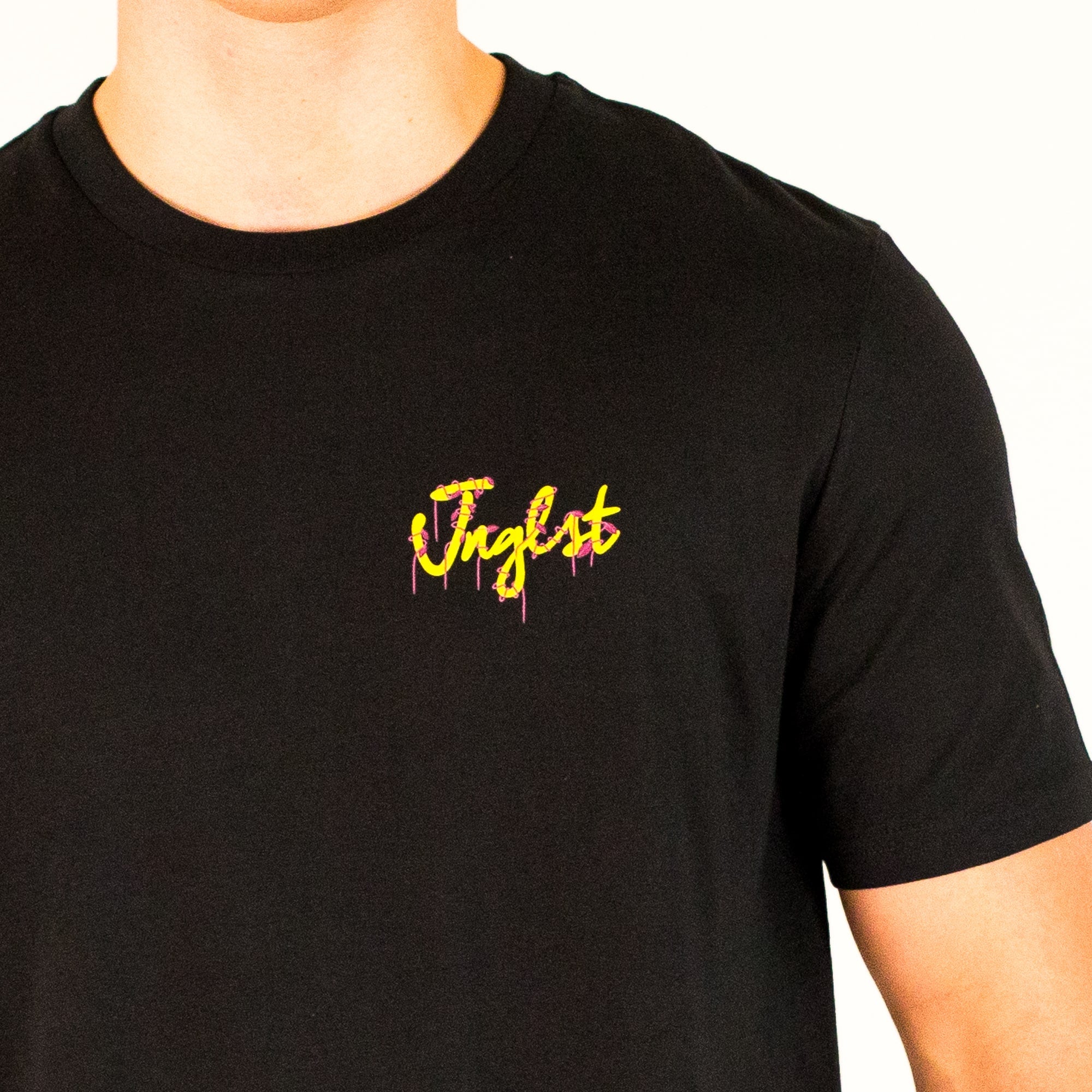 Black Vines t-shirt with yellow and pink text on a white background