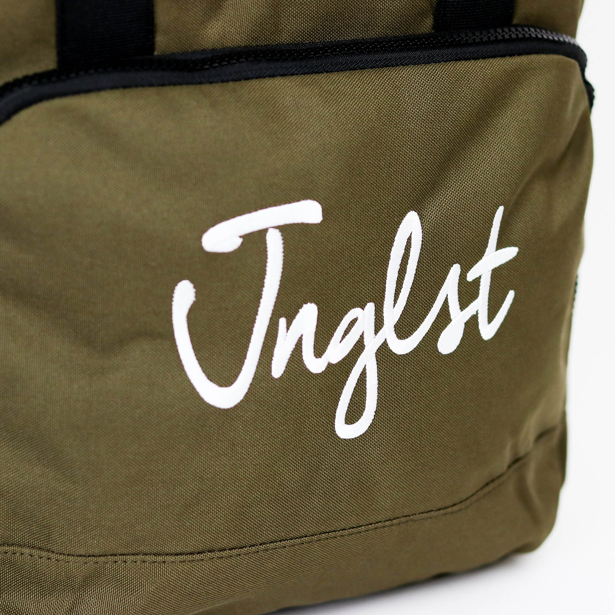Olive Green  bag with 'Jnglst' logo on a white background