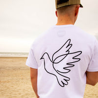White Dove Clothing T-Shirt worn by raver at the beach