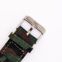 Camouflage watch strap with silver buckle and Jnglst logo on a white background