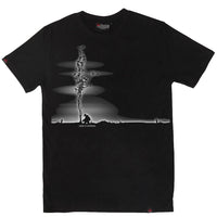 Black t-shirt with a graphic design of a person sitting under a tree with birds flying, on a white background.