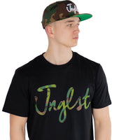 Jnglst camo script black t shirt worn by model in cap