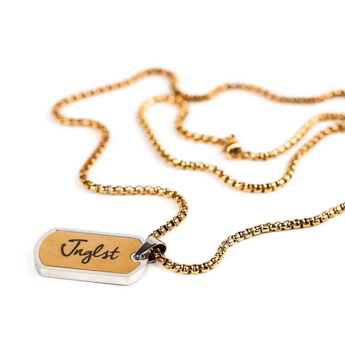 Jnglst gold and silver dog tag