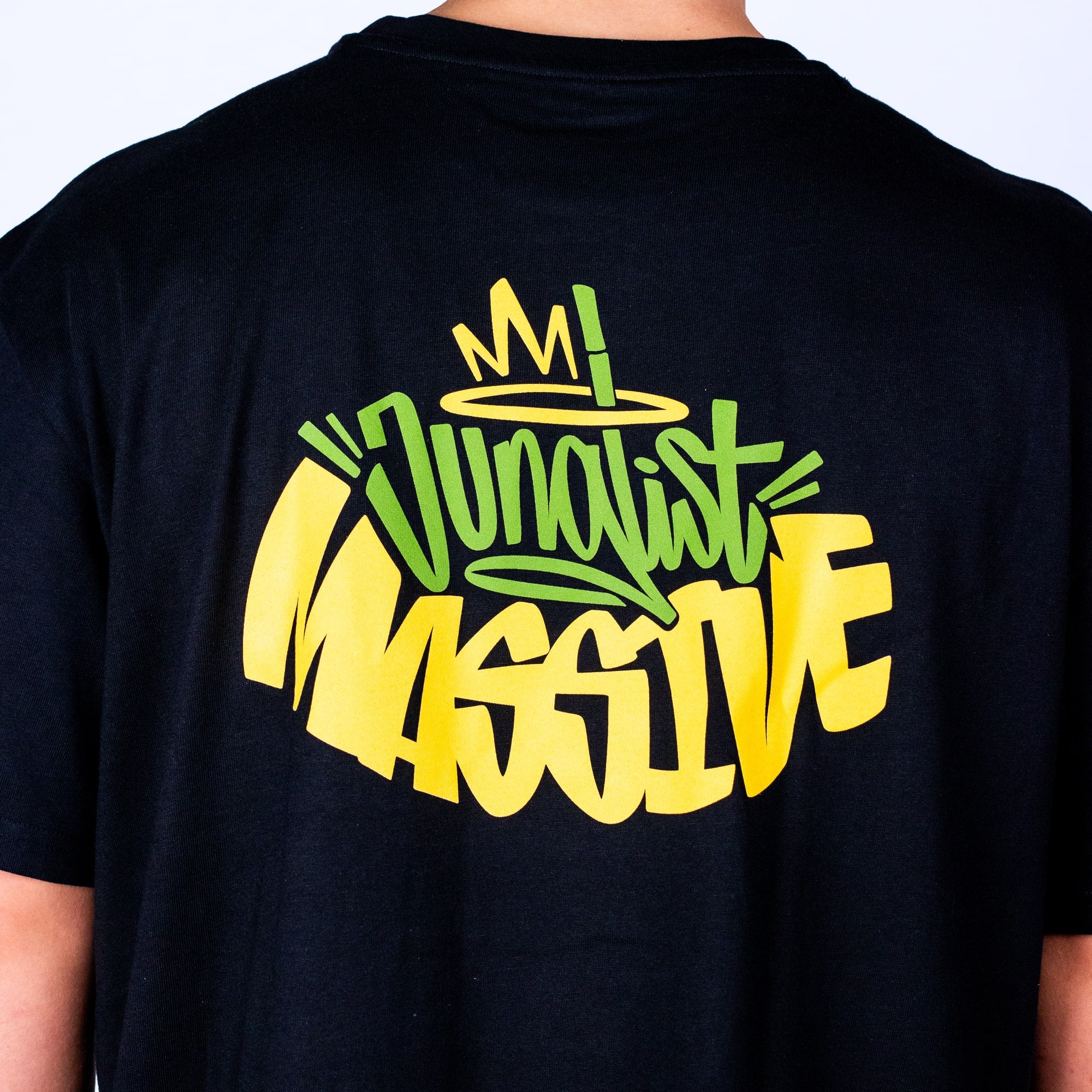 Black t-shirt with colorful Junglist Massive text design on the back against a plain background