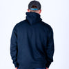 Person wearing a navy blue hoodie and cap on a white background