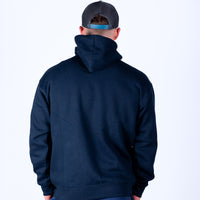 Person wearing a navy blue hoodie and cap on a white background