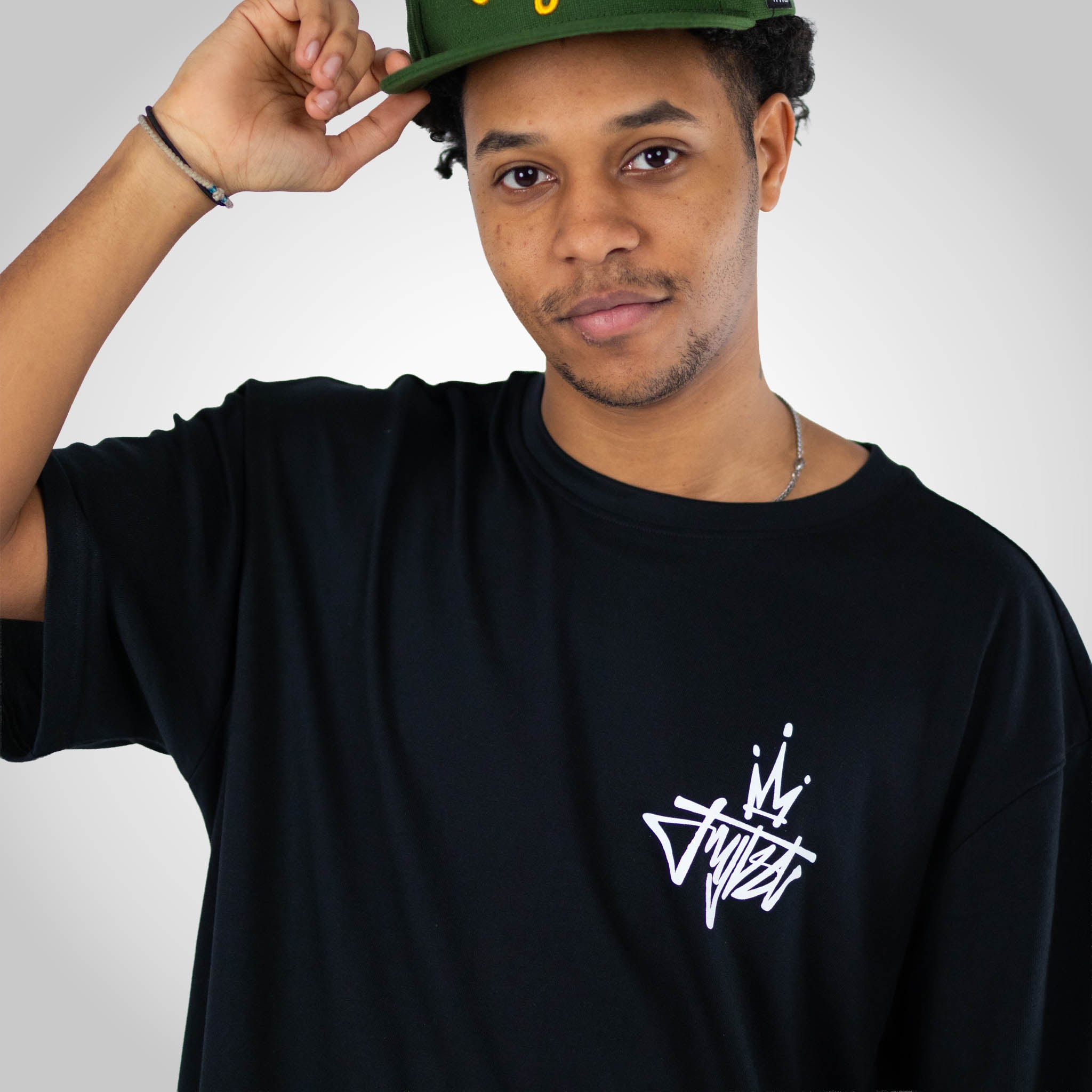 Royalty Crown Black T-Shirt worn by model in cap