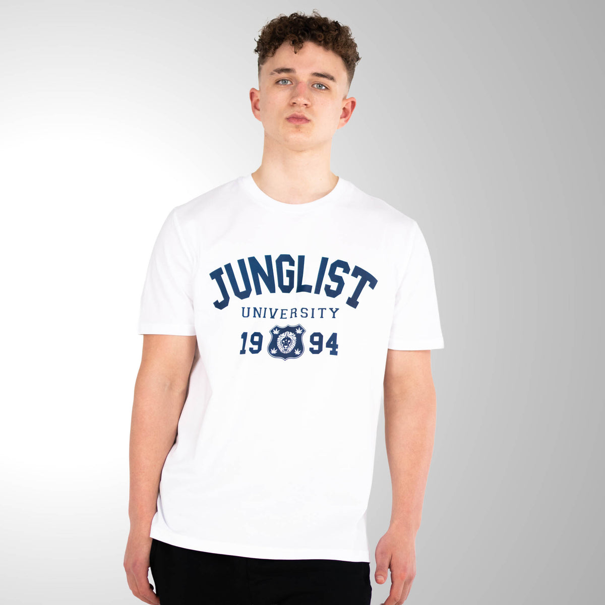 Person wearing a white t-shirt with 'Junglist University 1994' text on a gray background