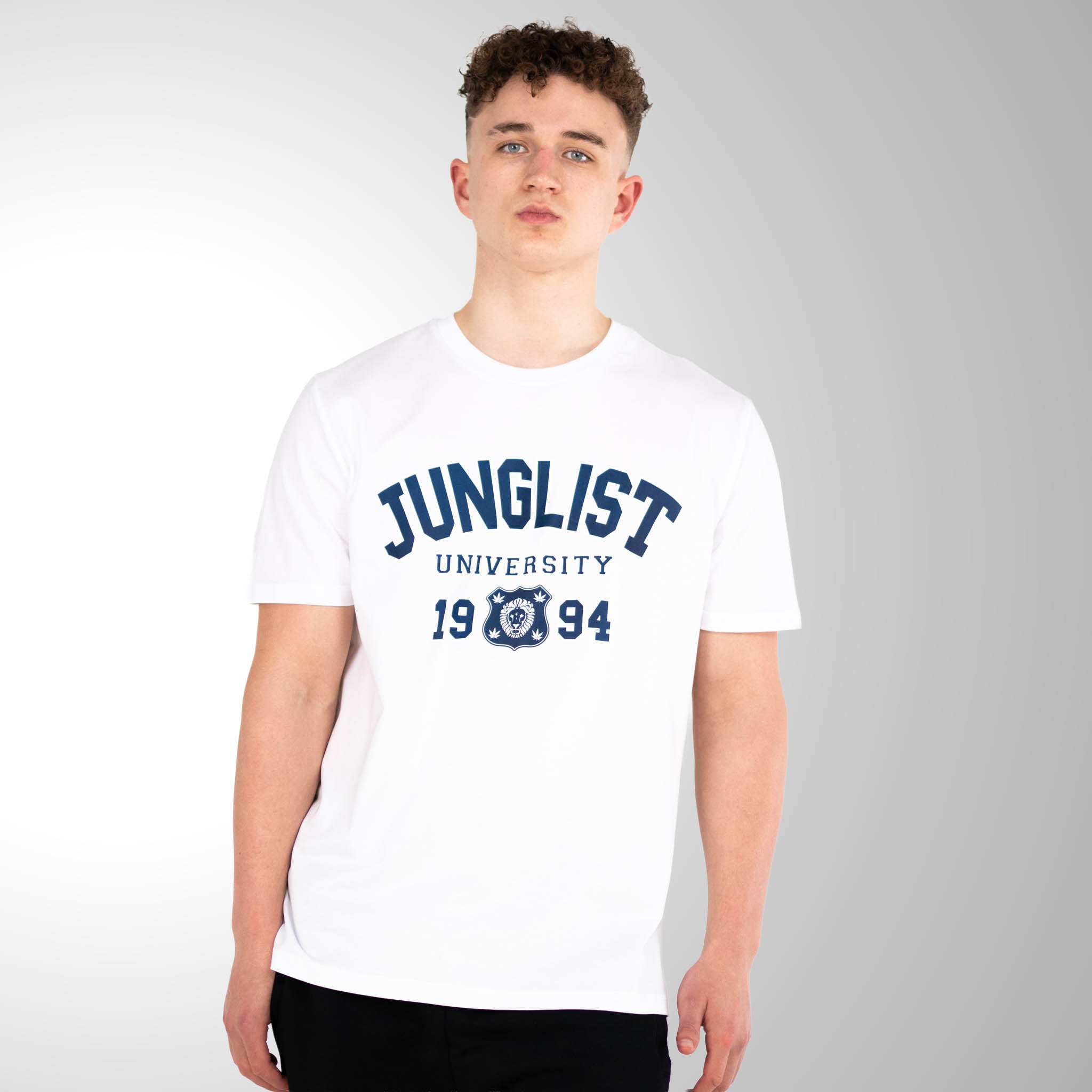 Person wearing a white t-shirt with 'Junglist University 1994' text on a gray background