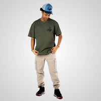 Royalty VIP crown Olive worn by model with blue cap