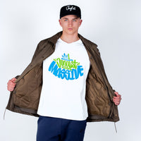 Person wearing a white t-shirt with colorful text, brown jacket, and black cap on a light gray background