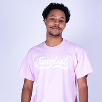 Person wearing a pink t-shirt with text on a light purple background