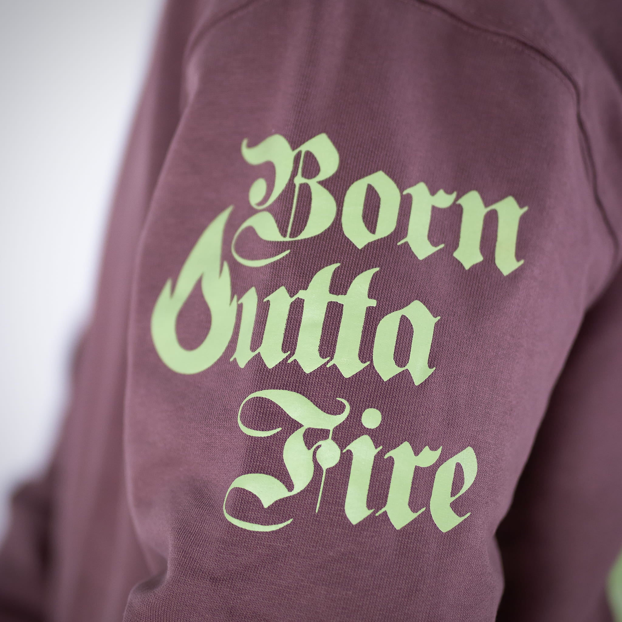 Born Outta Fire Flame Hoody text on hoody arm