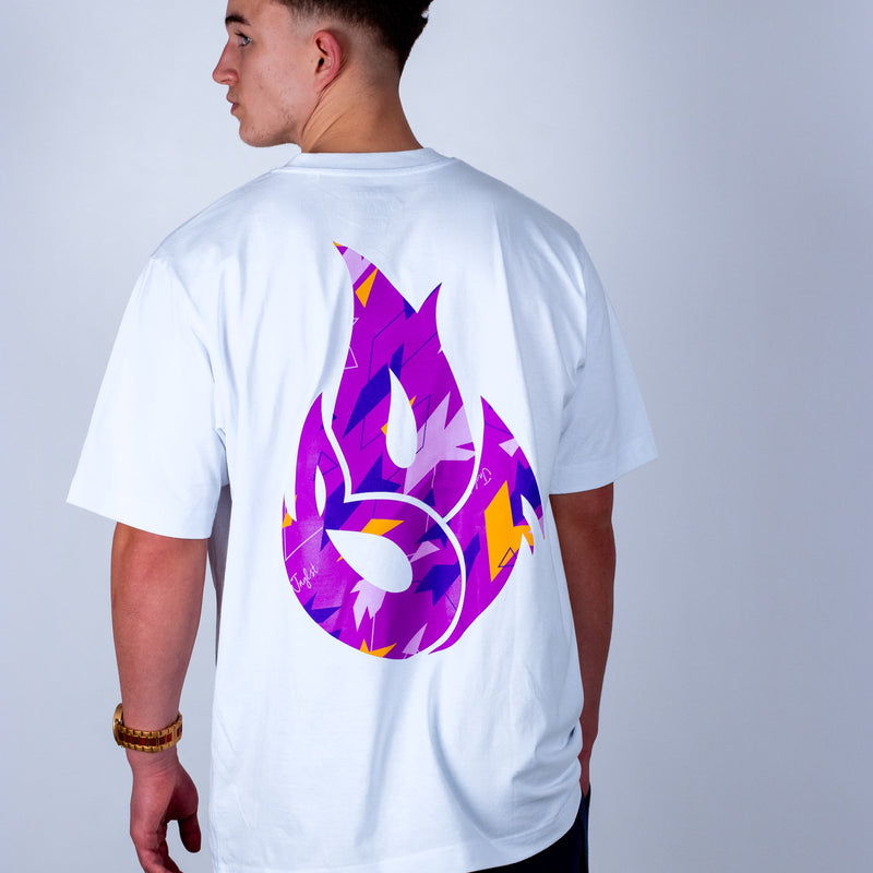 Person wearing a white Junglist t-shirt with a colorful logo on the back against a plain background