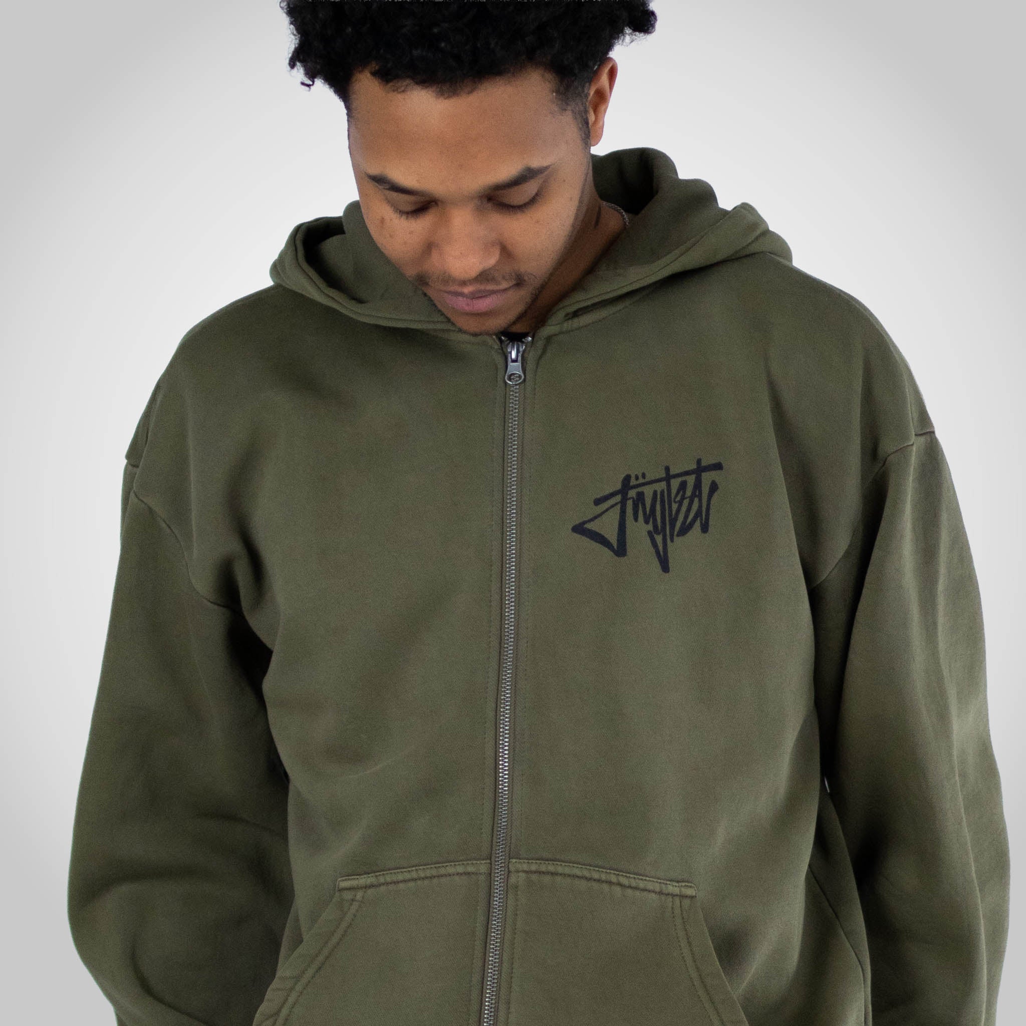 Rewired Smiley Olive Zip Hoody worn by a Junglist