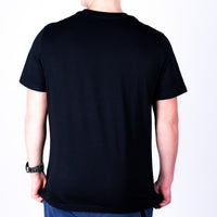 Black Super Sharp Shooter  t-shirt back worn by a person on a white background