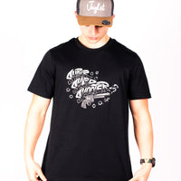 Person wearing a black Super Sharp Shooter t-shirt with white graphic design and a cap on a white background
