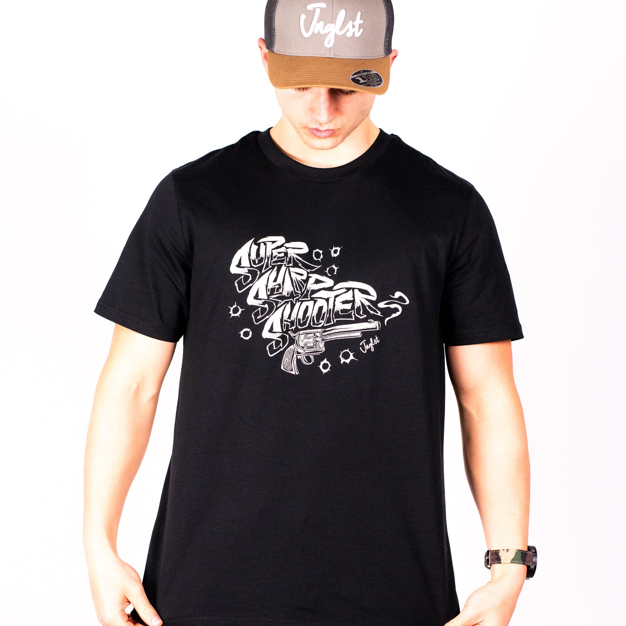 Person wearing a black Super Sharp Shooter t-shirt with white graphic design and a cap on a white background