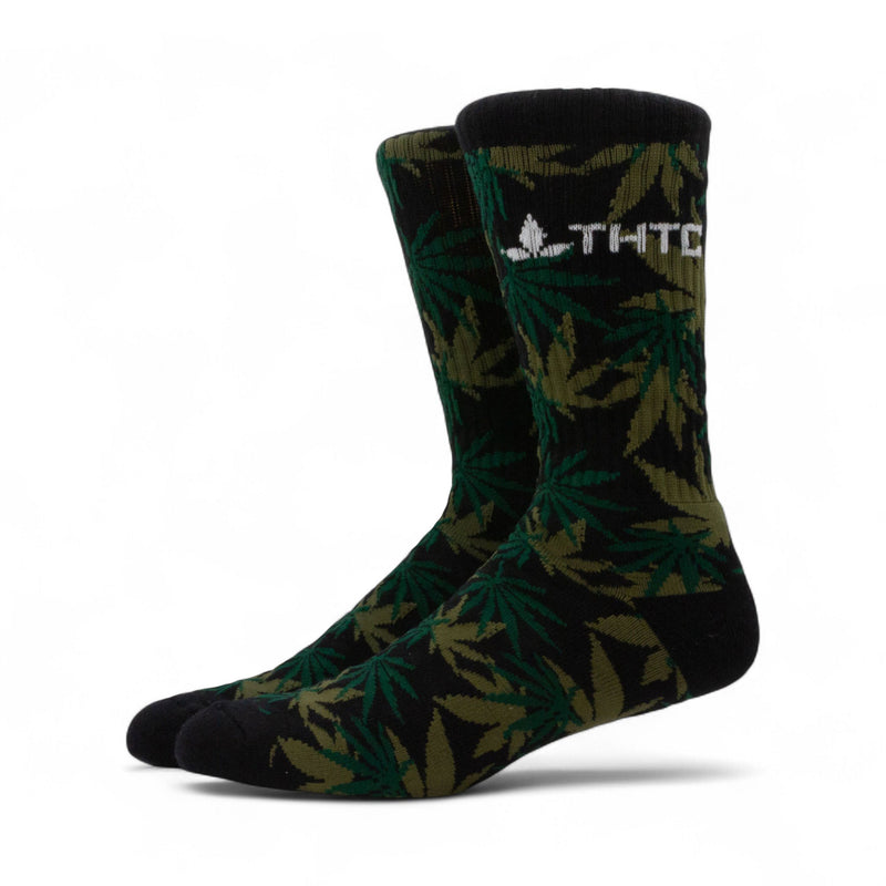 Green leaf-patterned socks with a logo on a white background