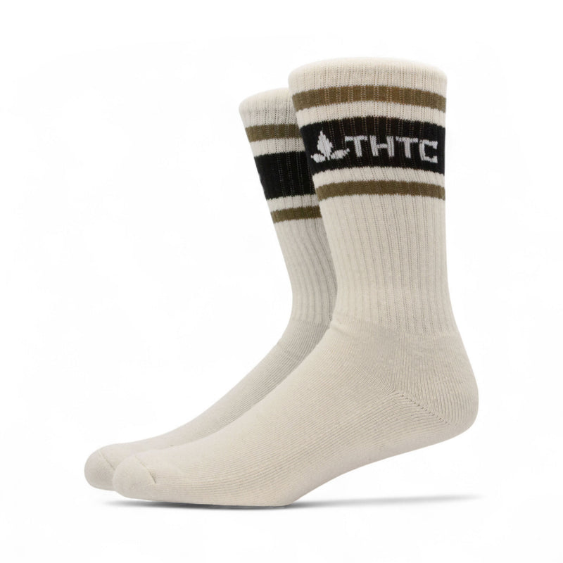 Pair of thtc hemp socks with striped design and logo on a white background