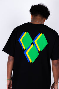 Person wearing a black t-shirt with colorful geometric design on the back against a white background