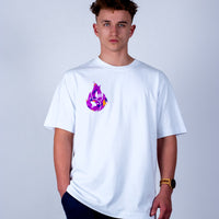 Person wearing a white t-shirt with a colorful graphic design on a plain background