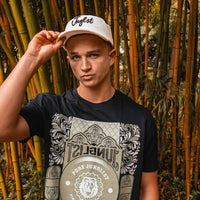 Model Wearing Jnglst THTC Cap