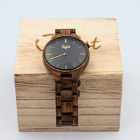 Wooden watch with black dial on a wooden Junglist case