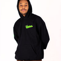 Person wearing a black yardrock diamond hoodie with green text on a white background