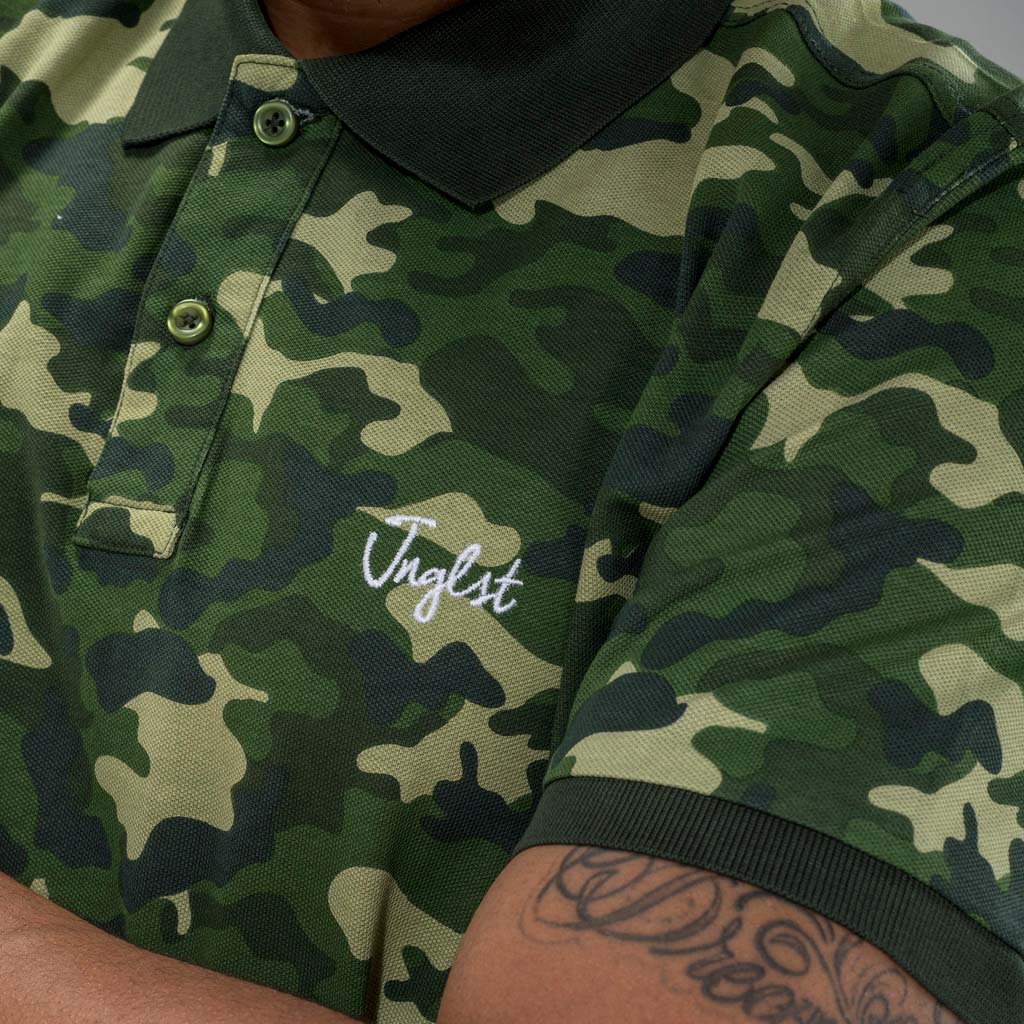 Close up of Junglist logo on Green Camo Polo Shirt