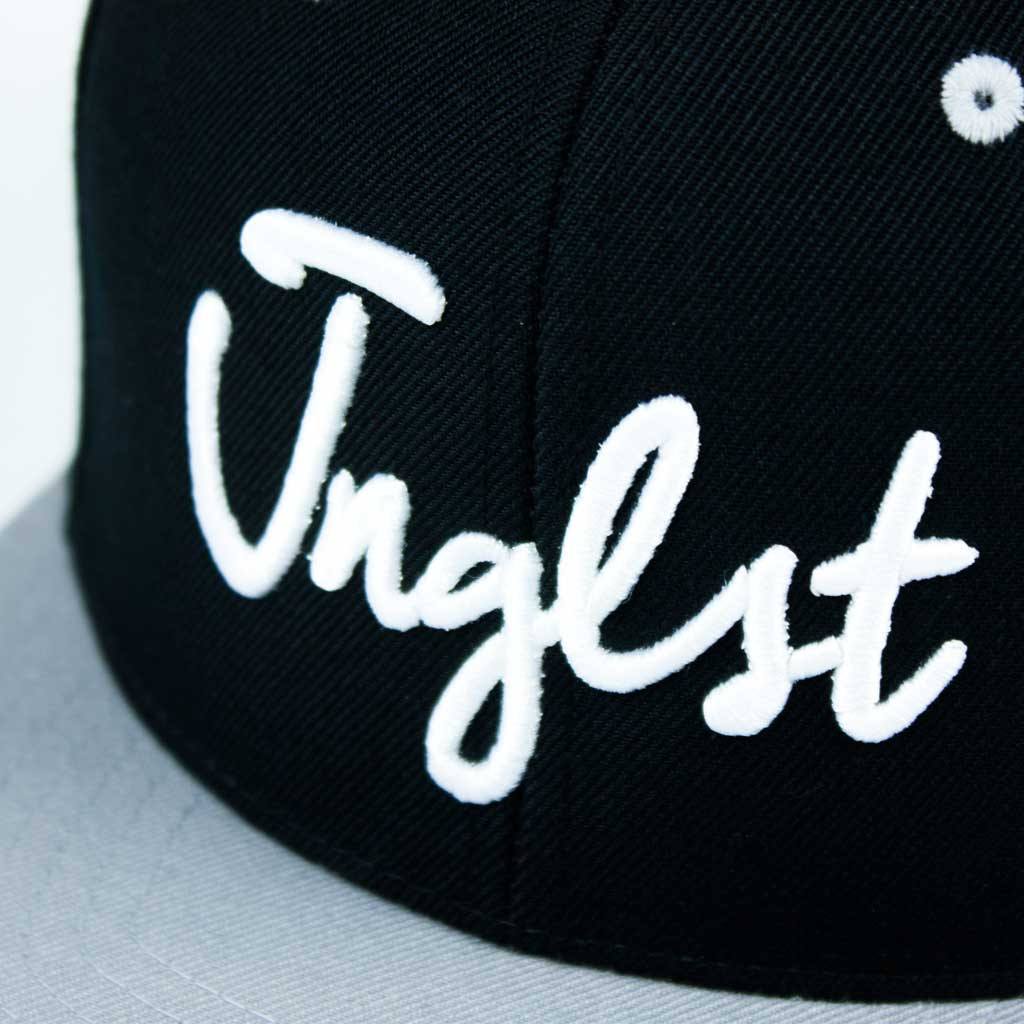 Close up Grey and Black 3d embroidered JNGLST Snapback