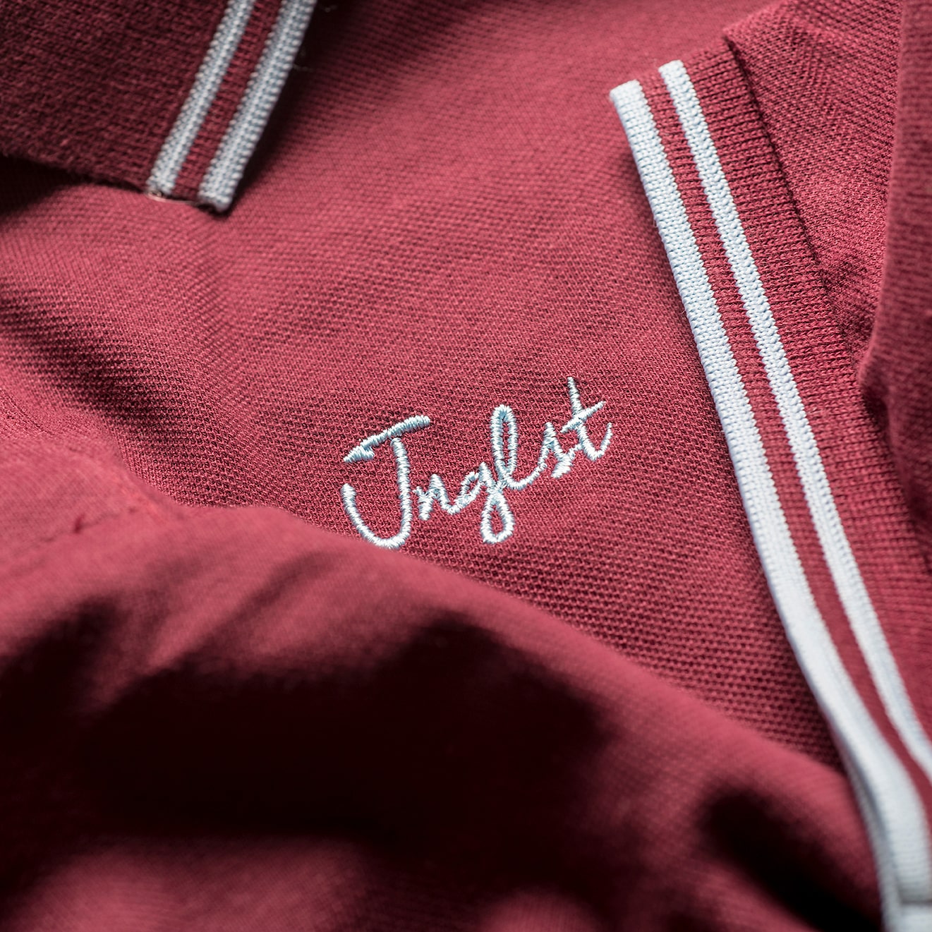 Close up of Junglist Clothing logo on Polo Shirt