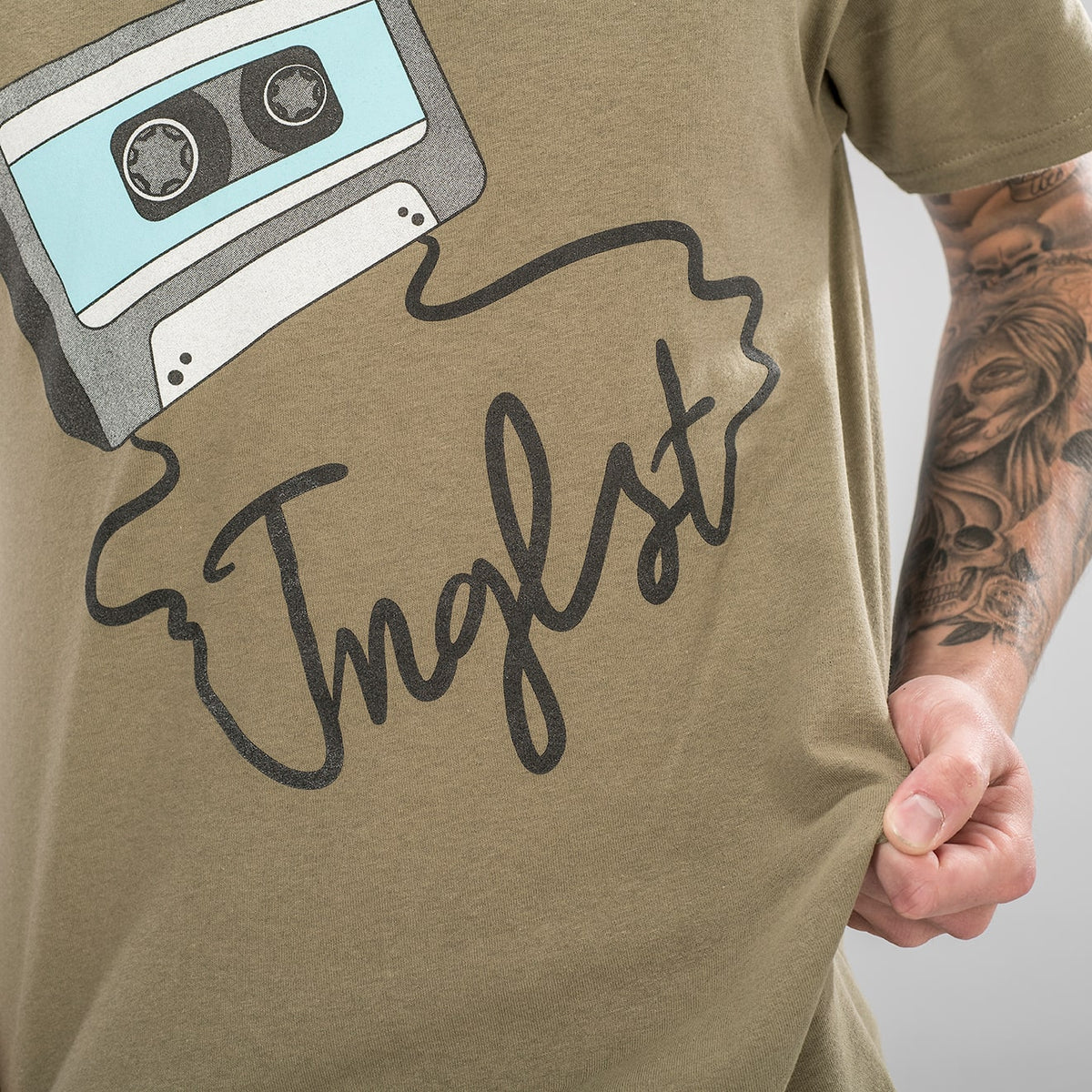 Mixtape Jnglst Design on a light brown tee