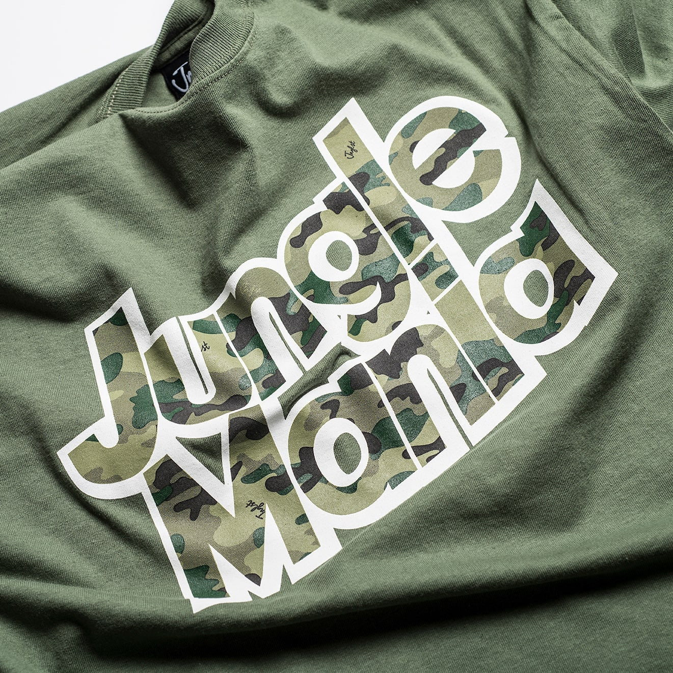 Green T-Shirt celebrating 25 years of Jungle Mania