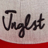 close up jnglst cap red and grey