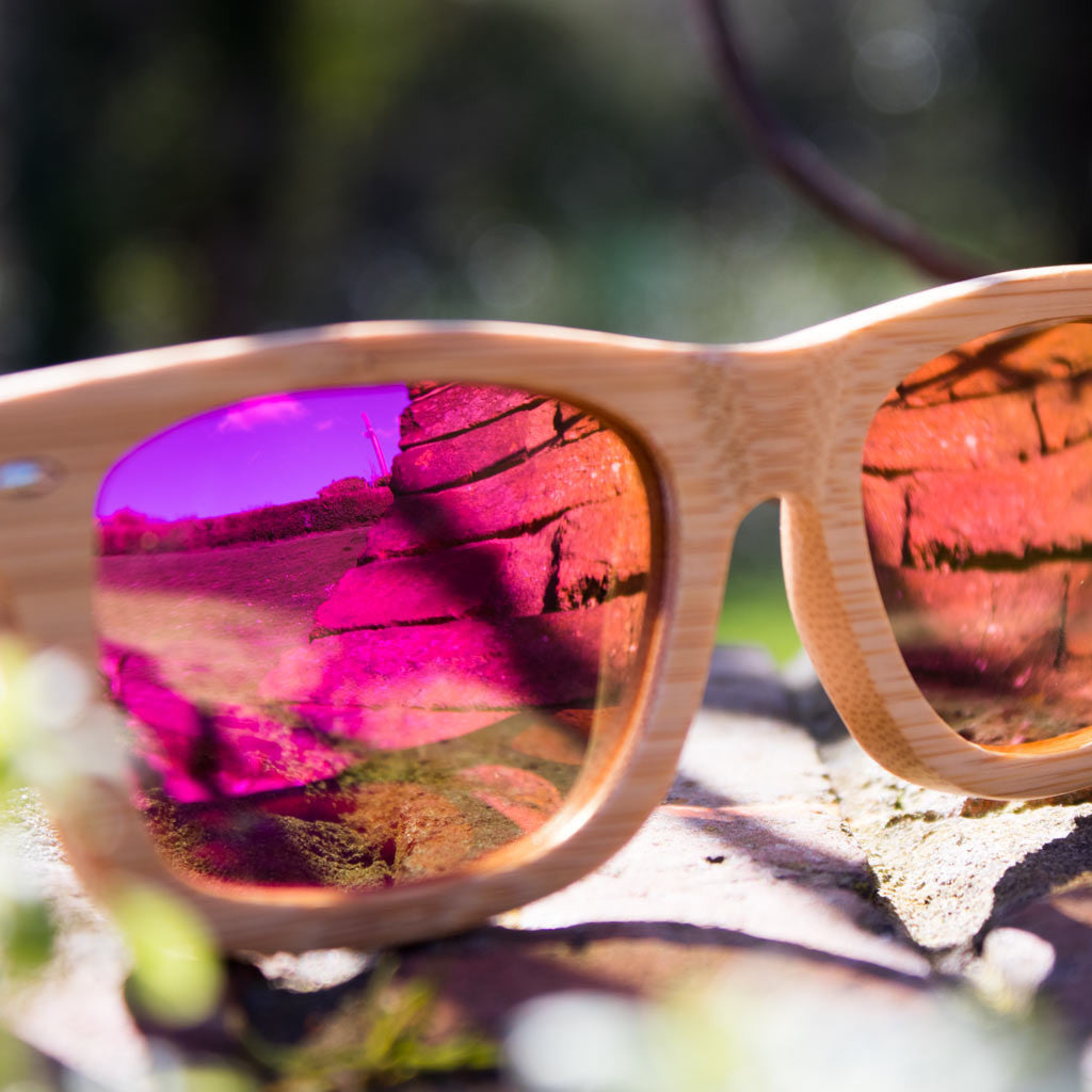 Jnglst Bamboo Sunglasses with pink lenses