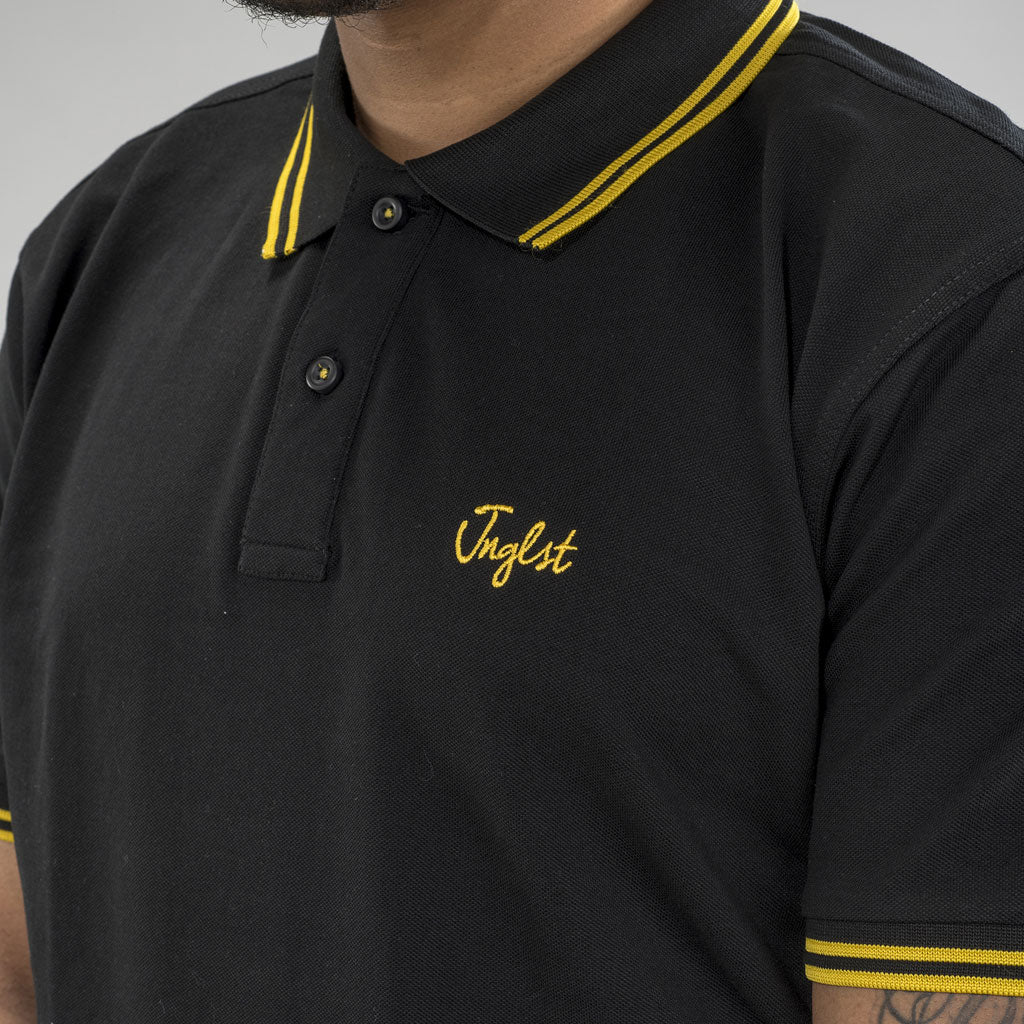Jnglst Logo on Black and Yellow Polo Shirt