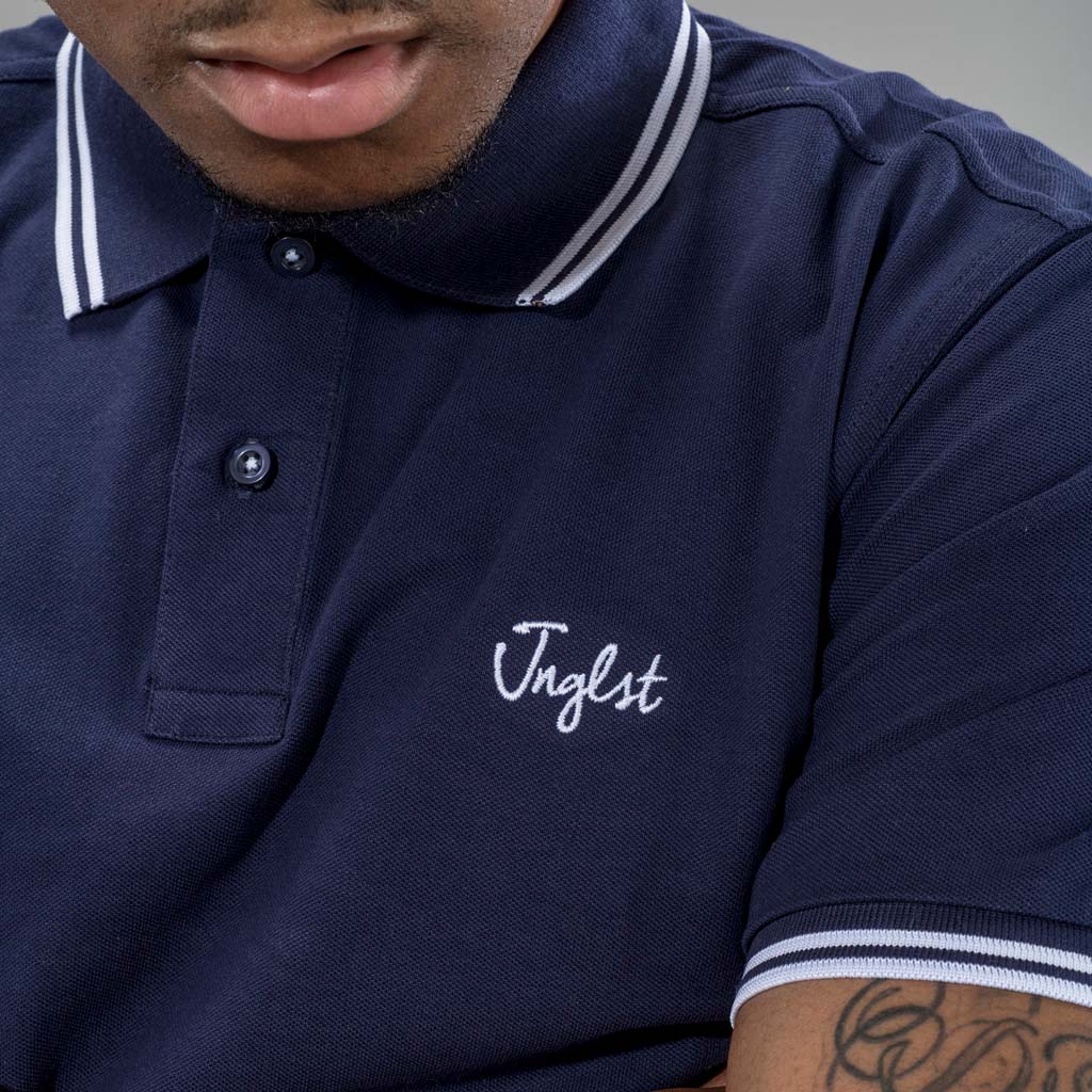 Jnglst Clothing logo on Navy Polo Shirt