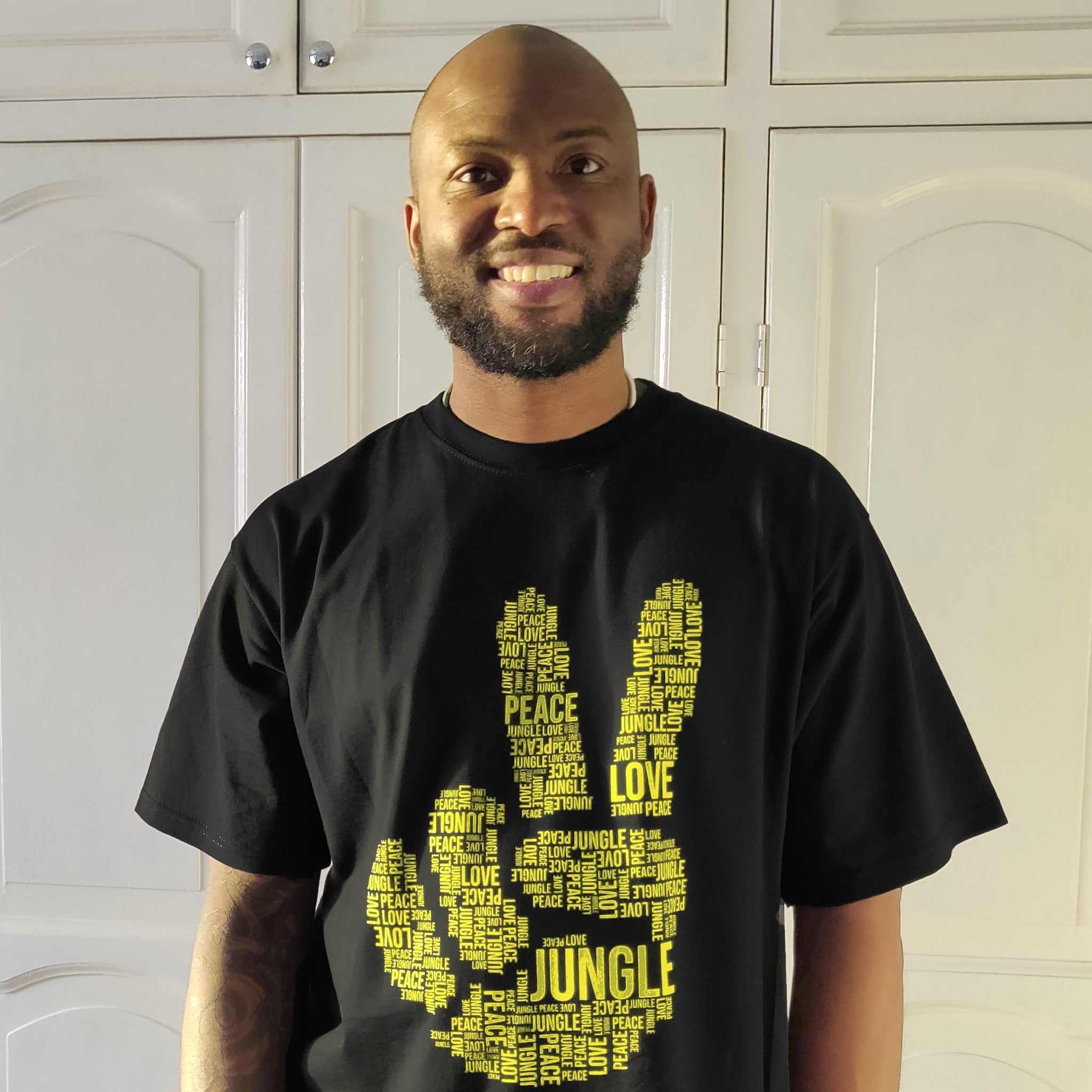 Parly B Wears Peace Love And Jungle T Shirt In Yellow Ink
